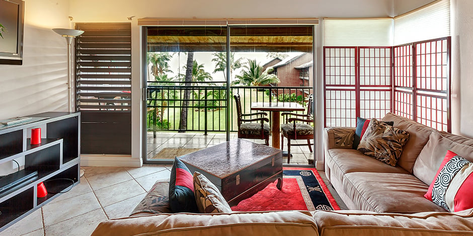 Living room area with access to Lanai in a 2-Bedroom Ocean View at Molokai Shores