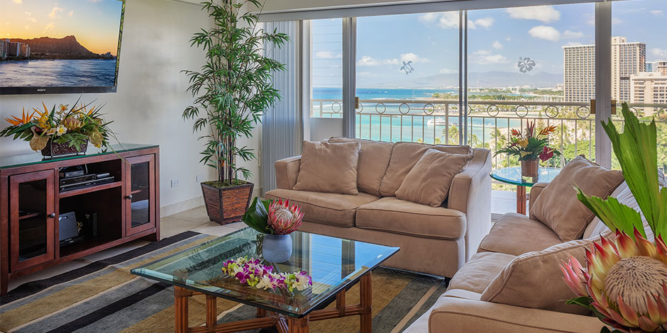 Living room for the 2 bedroom Deluxe Ocean View at Castle Waikiki Shore